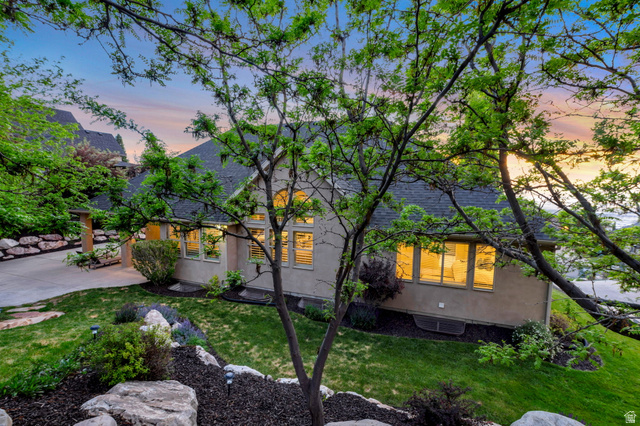 577 South Ridge Top Lane East North Salt Lake, UT 84054 - Photo 47 of 57 A peaceful backyard sanctuary surrounded by mature landscaping, natural shade, and beautifully maintained grounds.