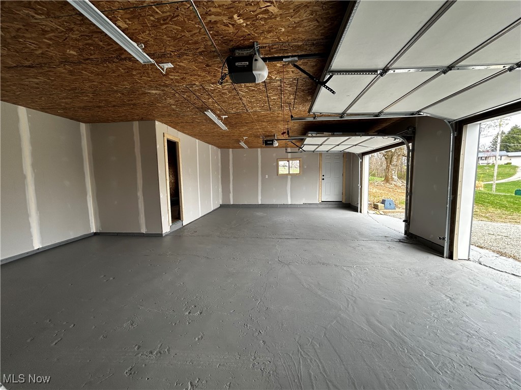 3465 Ridge Road Zanesville, OH 43701 - Photo 14 of 16 Garage with a garage door opener