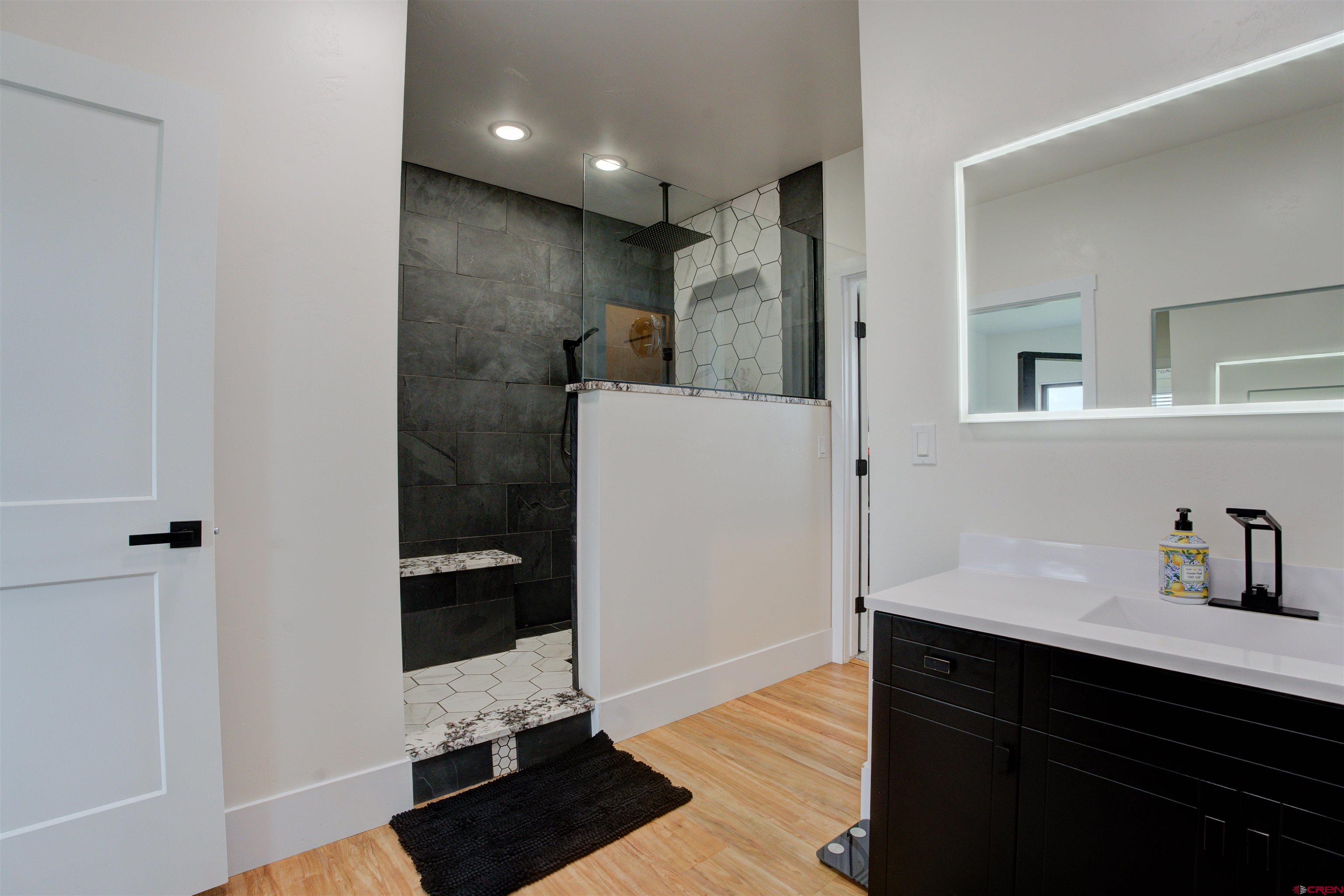 25320 Rd N.8 Loop Cortez, CO 81321 - Photo 17 of 40 a bathroom with a sink and a mirror