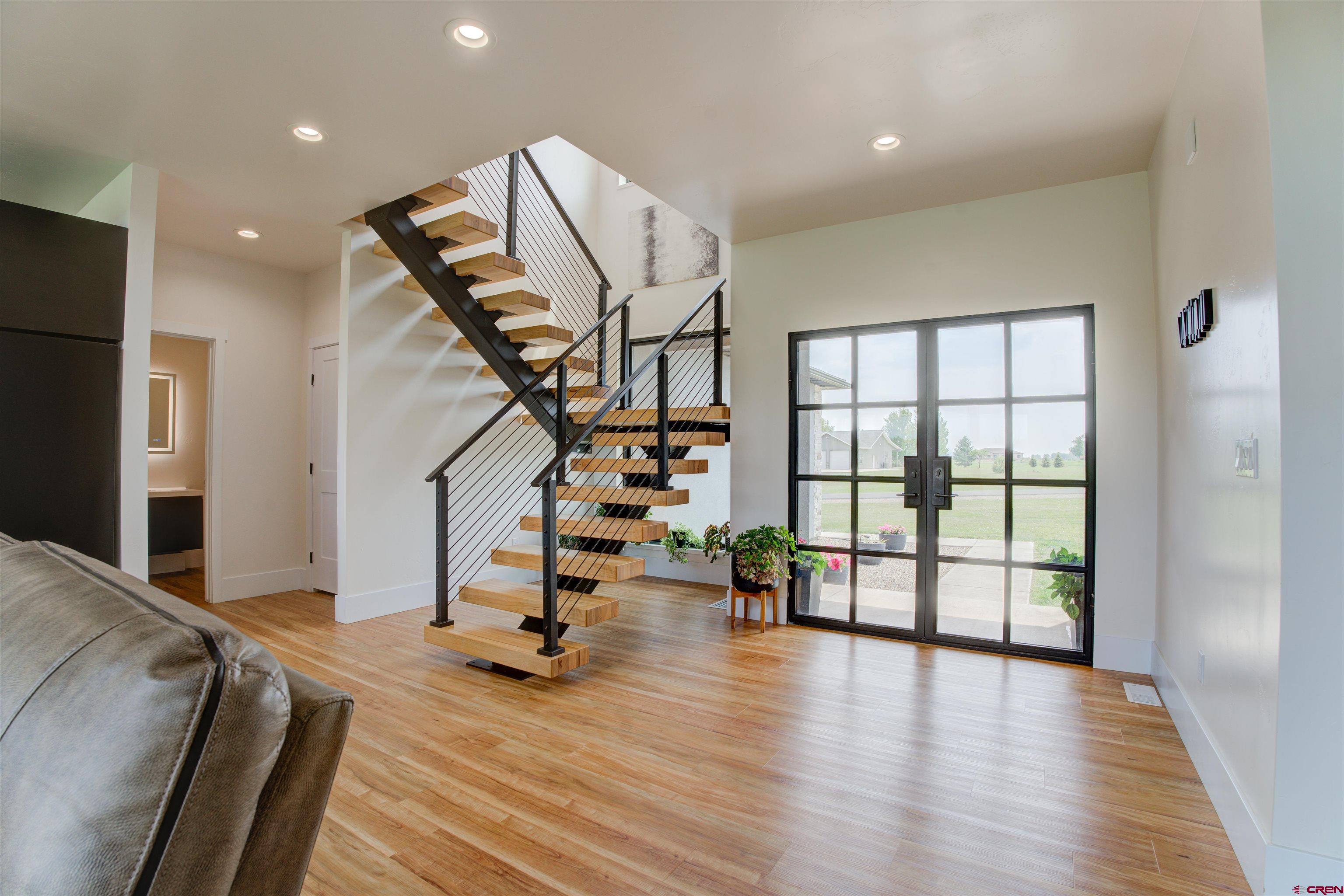25320 Rd N.8 Loop Cortez, CO 81321 - Photo 23 of 40 a view of a room with wooden floor and stairs