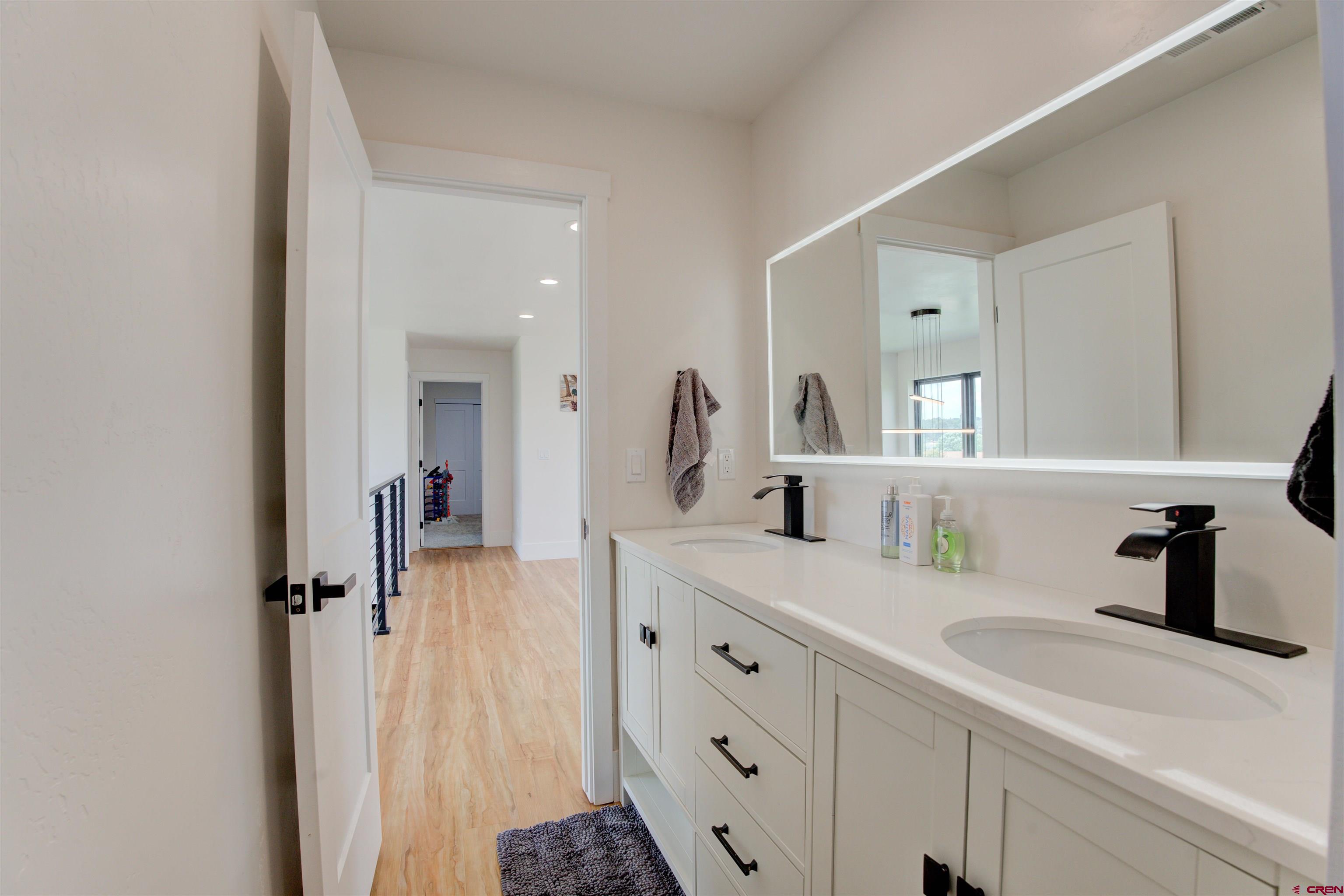 25320 Rd N.8 Loop Cortez, CO 81321 - Photo 27 of 40 a bathroom with a sink double vanity