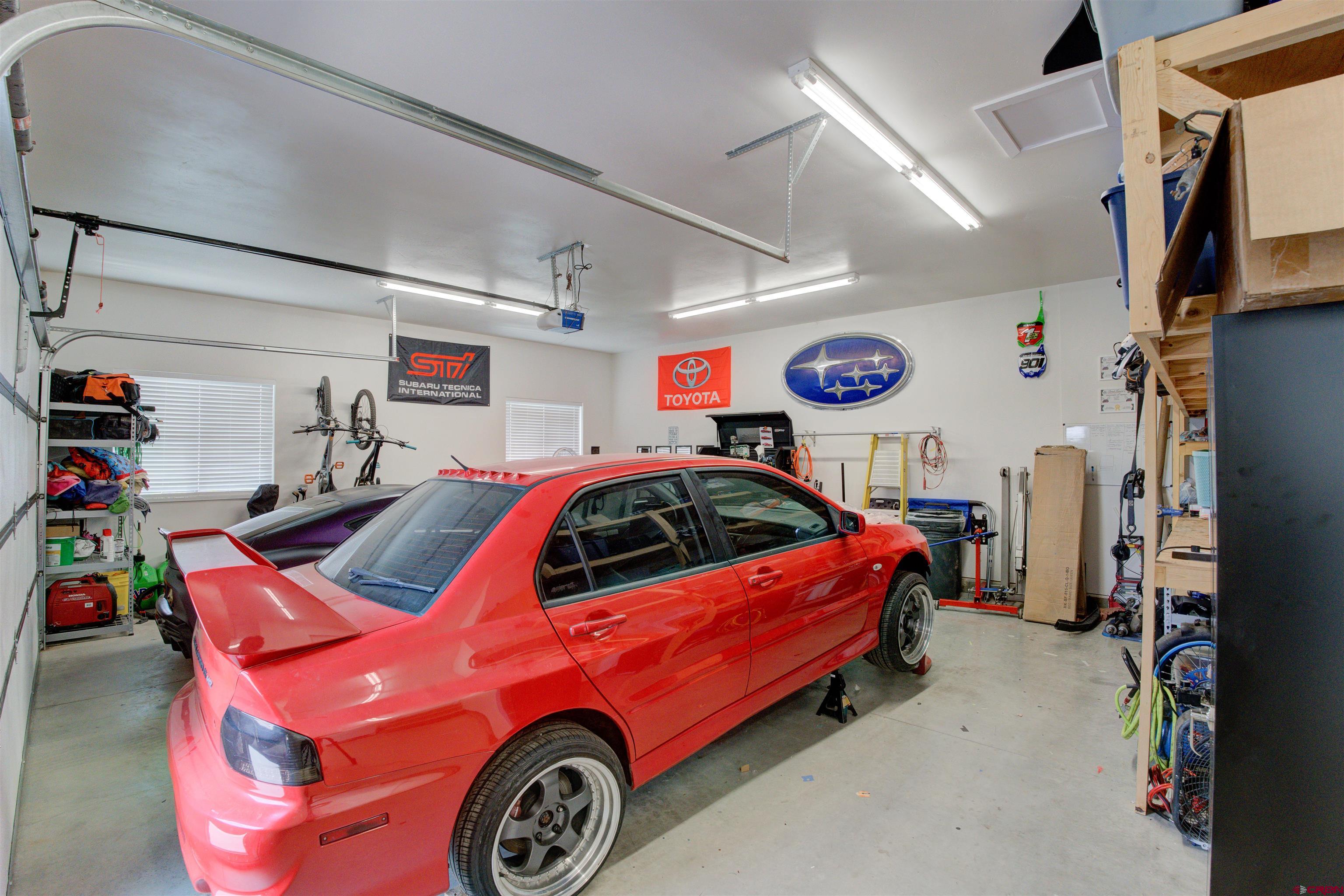 25320 Rd N.8 Loop Cortez, CO 81321 - Photo 32 of 40 a car and bike in a garage