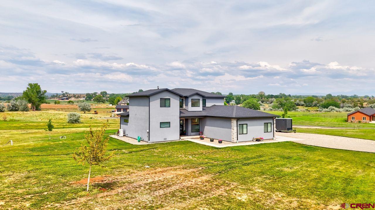 25320 Rd N.8 Loop Cortez, CO 81321 - Photo 37 of 40 a aerial view of a house with a big yard potted plants and large tree