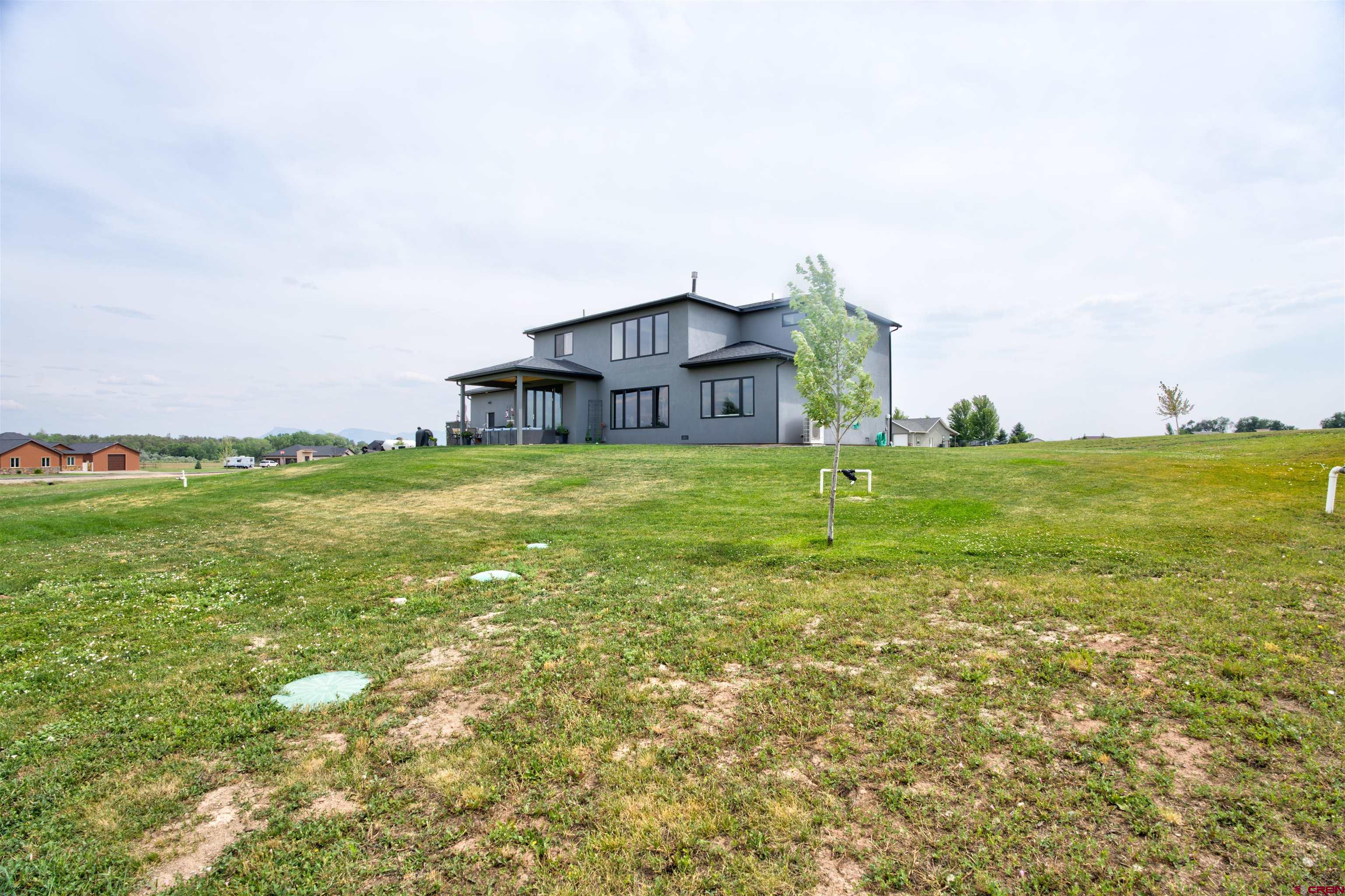 25320 Rd N.8 Loop Cortez, CO 81321 - Photo 38 of 40 a view of a big yard with an ocean view