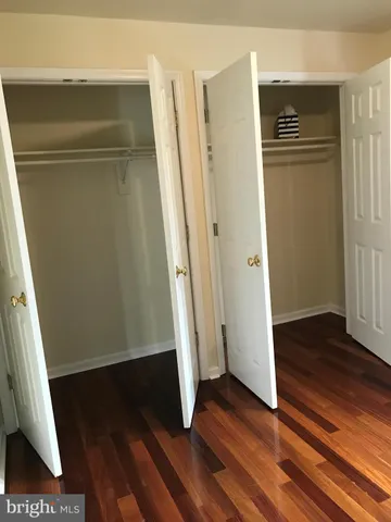 an entryway with wooden floor