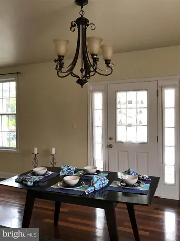 a table and a chair in a room