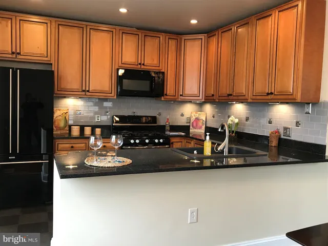 a kitchen with lots of counter top space and appliances