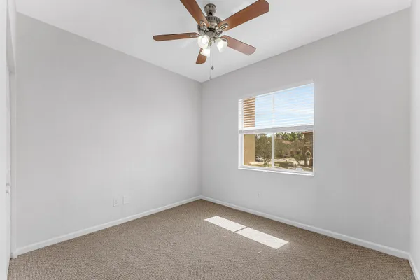 a view of a hallway with wooden floor and entryway