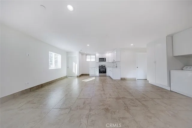 a bathroom with a toilet sink shower and mirror