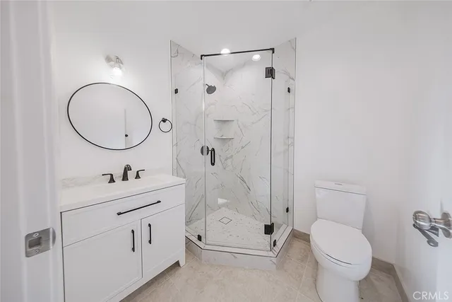 a view of a patio with table and chairs potted plants
