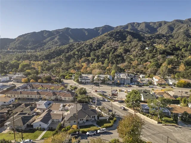 an aerial view of residential house and sandy dunes