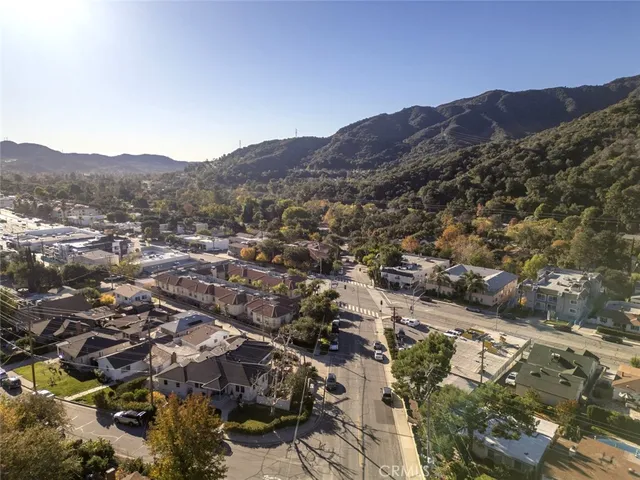 an aerial view of residential house and car parked