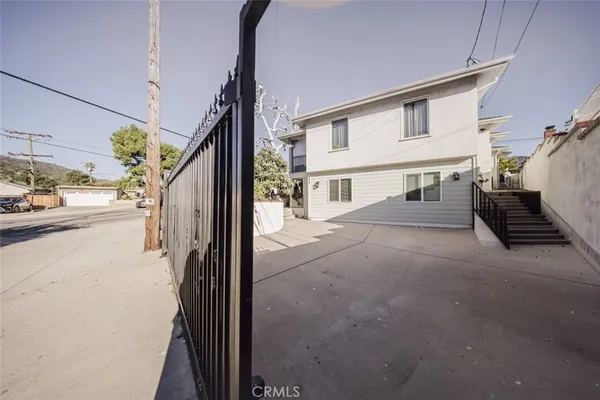 a view of a street with car parked on road