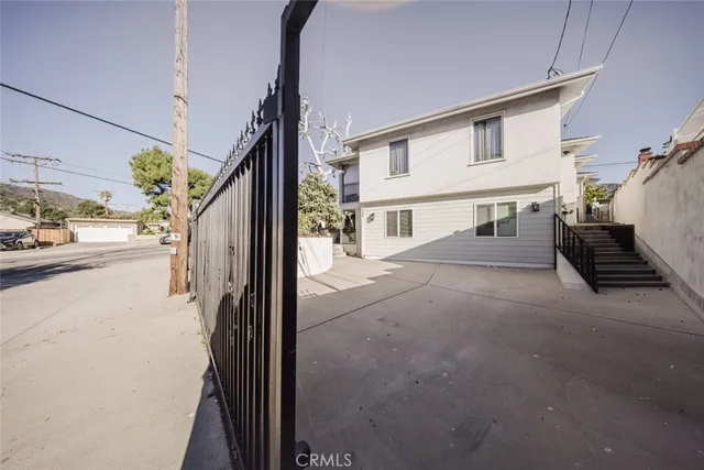 a view of a street with car parked on road