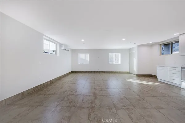 a view of empty room with a fireplace