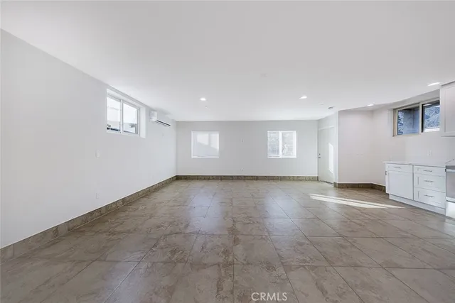 a view of empty room with a fireplace