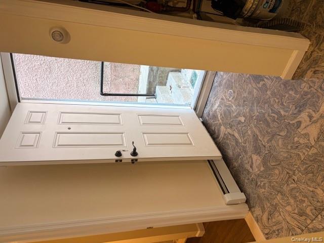 42 Hasbrouck Street Newburgh, NY 12550 - Photo 12 of 24 Foyer with baseboard heating and baseboards