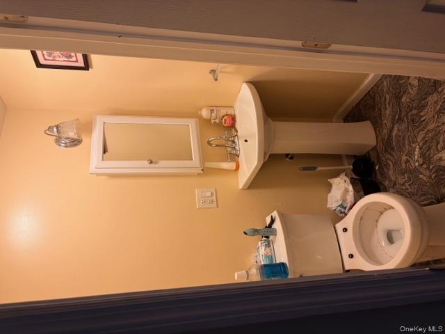 42 Hasbrouck Street Newburgh, NY 12550 - Photo 16 of 24 Bathroom with toilet and baseboards