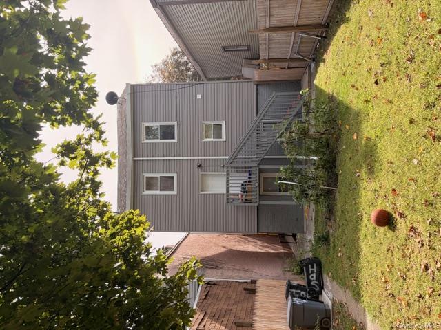 42 Hasbrouck Street Newburgh, NY 12550 - Photo 3 of 24 Rear view of property featuring stairs and a patio