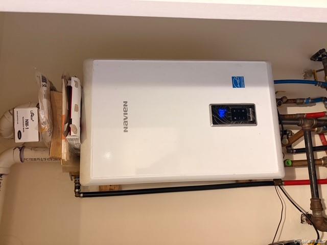 42 Hasbrouck Street Newburgh, NY 12550 - Photo 9 of 24 Utility room featuring water heater