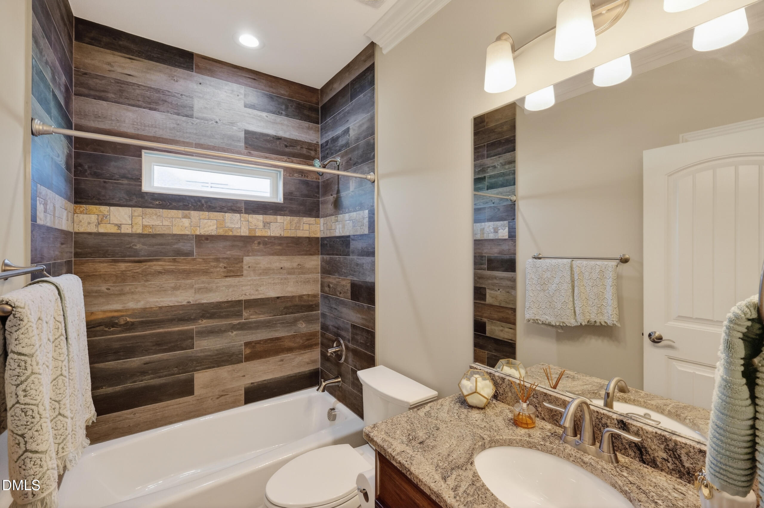 261 Character Drive Rolesville, NC 27571 - Photo 31 of 77 a bathroom with a granite countertop sink toilet and shower