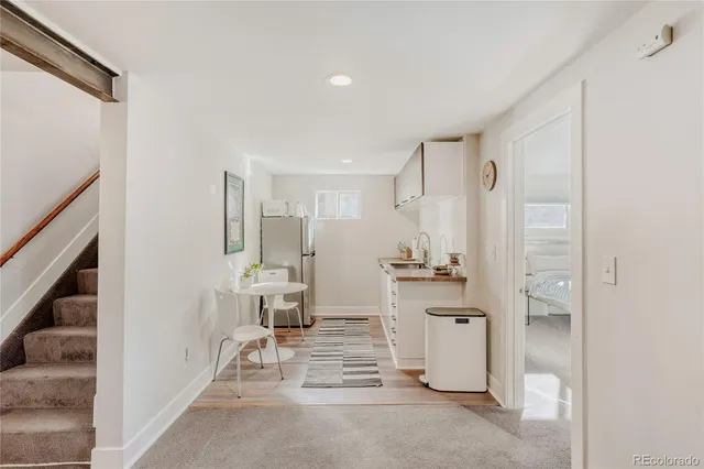 a very nice looking dining room with a table and chairs