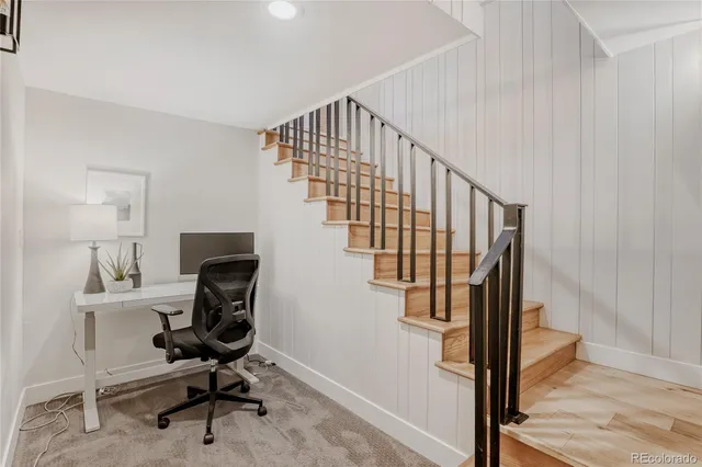 a bedroom with a bed and a ceiling fan