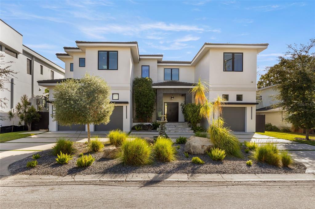 front view of a house with a small yard
