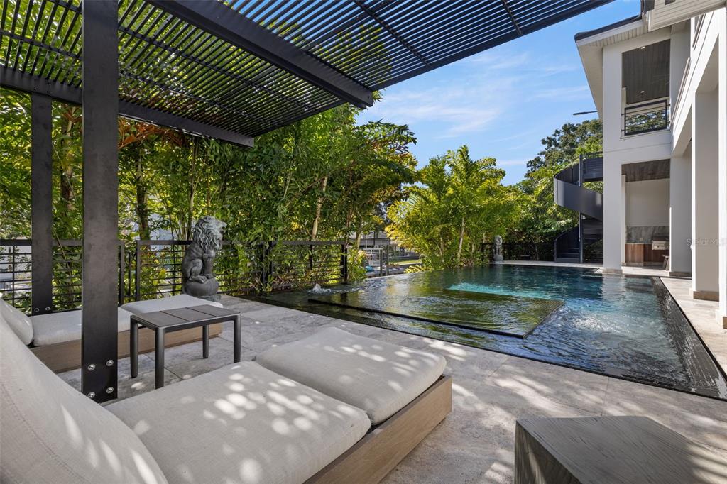 4924 West San Rafael Street Tampa, FL 33629 - Photo 11 of 64 a view of backyard with plants and outdoor seating