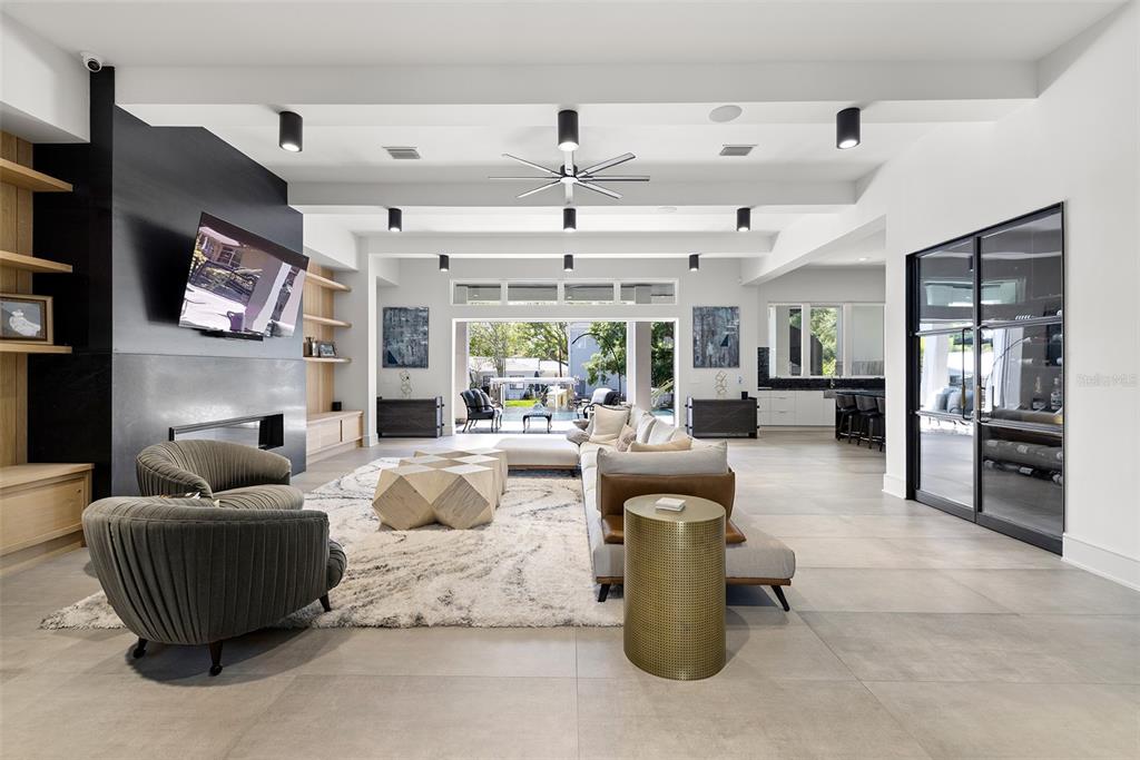 4924 West San Rafael Street Tampa, FL 33629 - Photo 13 of 64 a living room with furniture and a chandelier