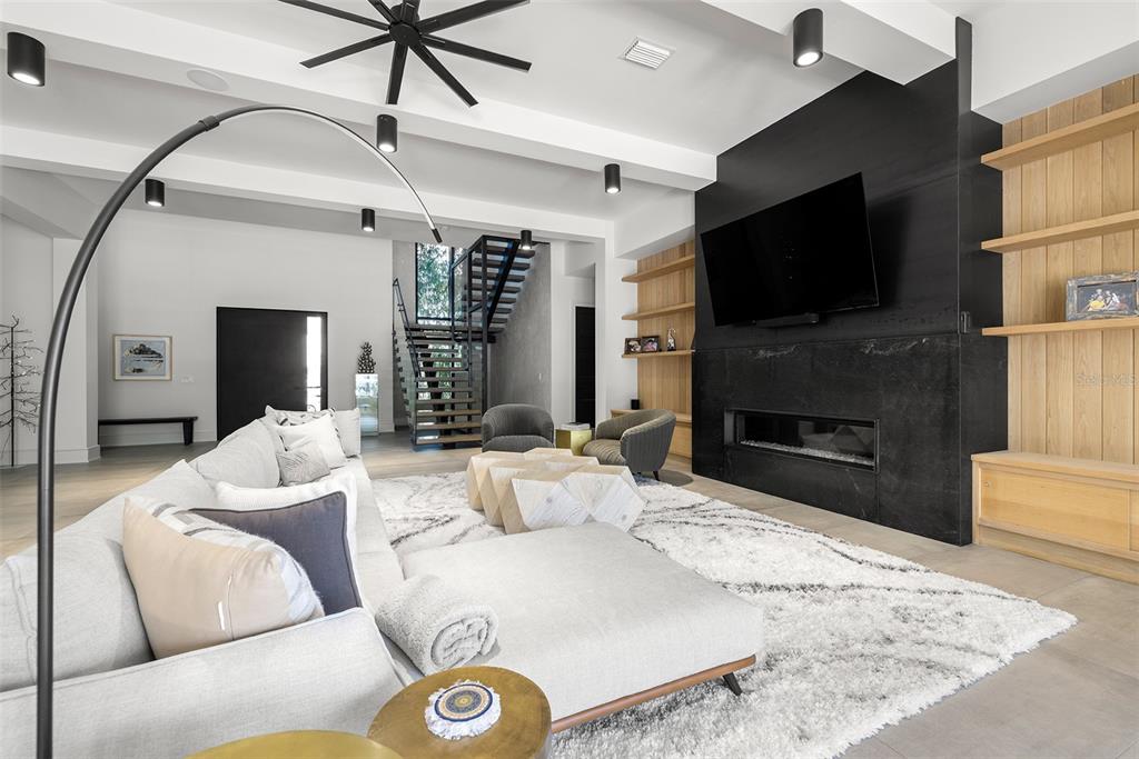 4924 West San Rafael Street Tampa, FL 33629 - Photo 16 of 64 a living room with furniture and a flat screen tv