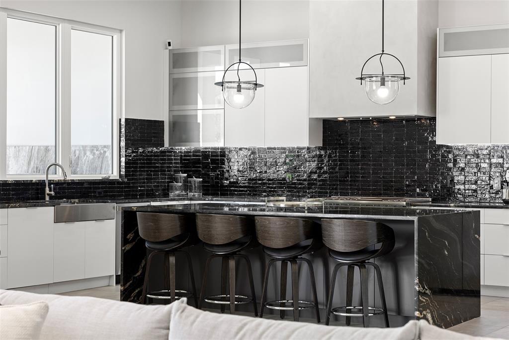 4924 West San Rafael Street Tampa, FL 33629 - Photo 17 of 64 a kitchen with a table chairs stove and cabinets