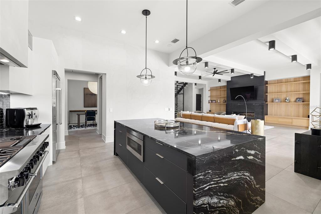 4924 West San Rafael Street Tampa, FL 33629 - Photo 21 of 64 a large kitchen with stainless steel appliances granite countertop a stove oven and a kitchen island