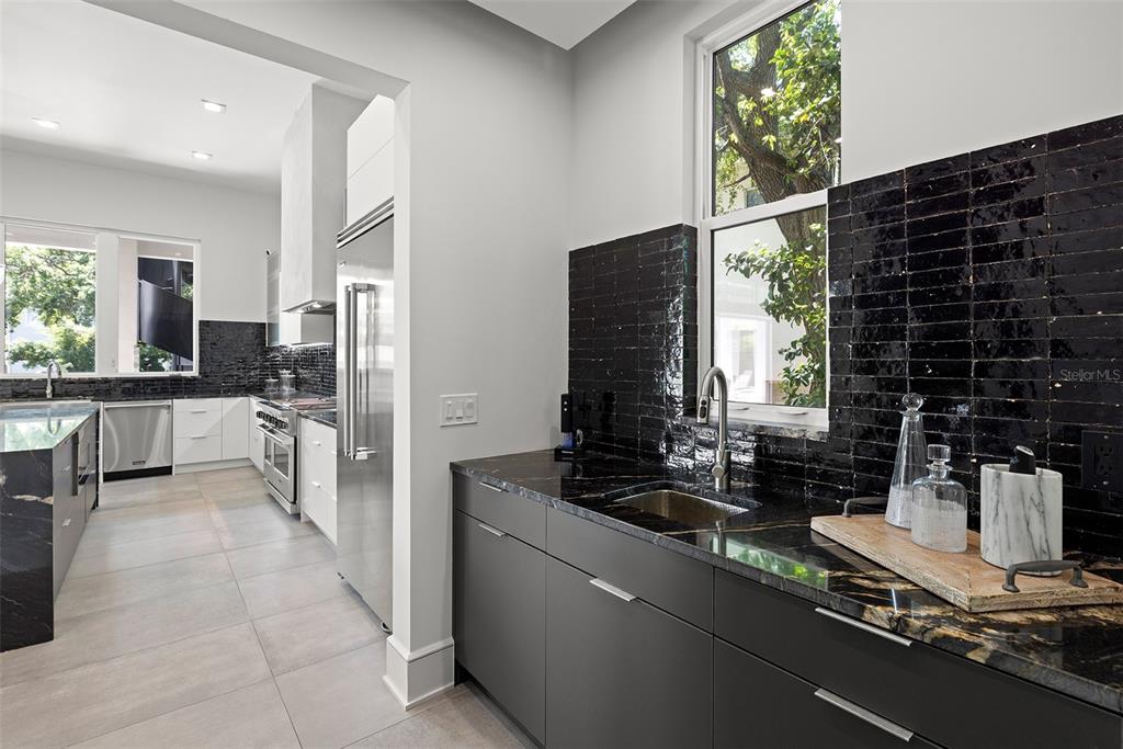 4924 West San Rafael Street Tampa, FL 33629 - Photo 22 of 64 a kitchen with counter top space cabinets and a sink