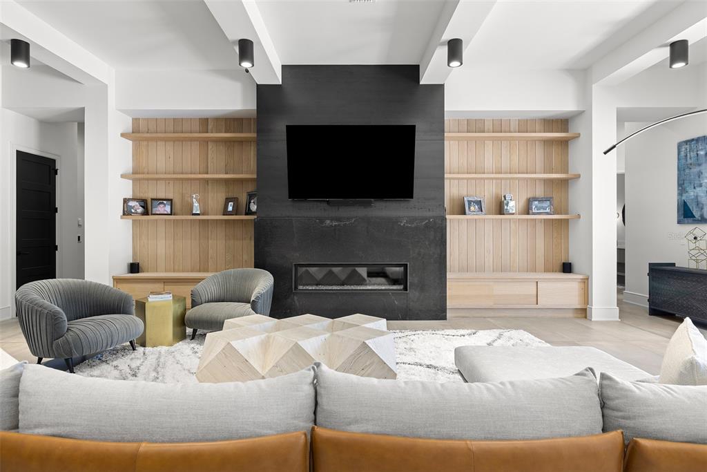 4924 West San Rafael Street Tampa, FL 33629 - Photo 30 of 64 a living room with furniture and a flat screen tv