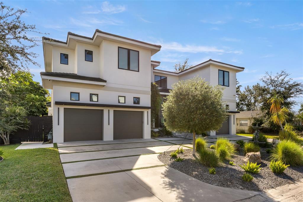 4924 West San Rafael Street Tampa, FL 33629 - Photo 3 of 64 a front view of a house with a garden