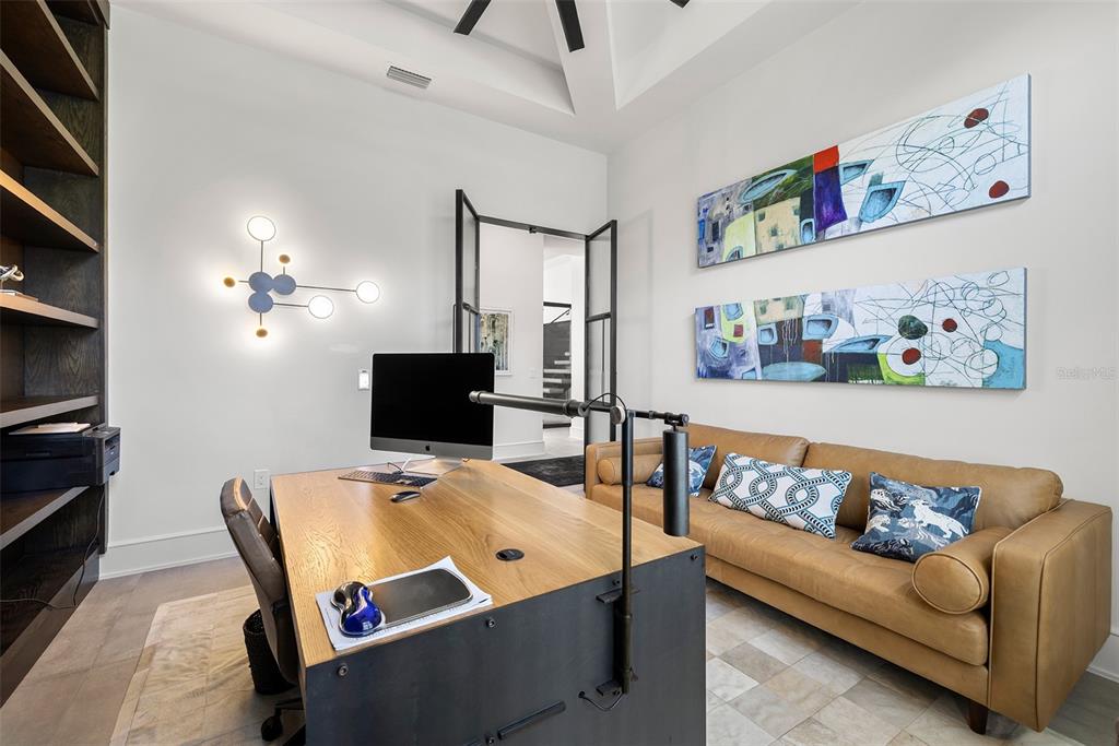4924 West San Rafael Street Tampa, FL 33629 - Photo 32 of 64 a living room with furniture and a flat screen tv
