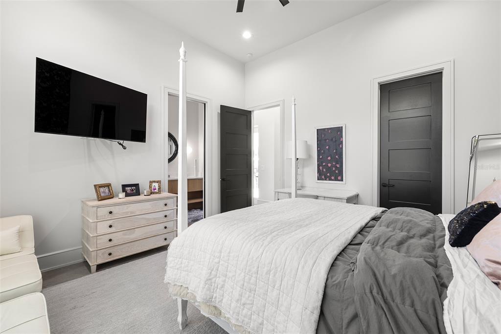 4924 West San Rafael Street Tampa, FL 33629 - Photo 40 of 64 a bedroom with a bed and a flat screen tv