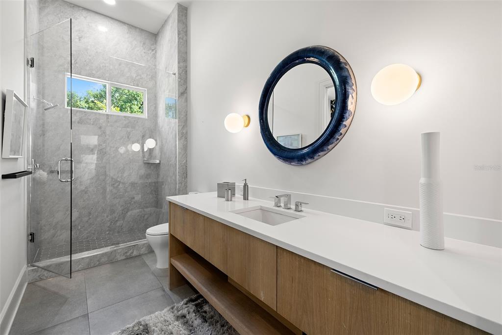 4924 West San Rafael Street Tampa, FL 33629 - Photo 41 of 64 a bathroom with a sink and a mirror