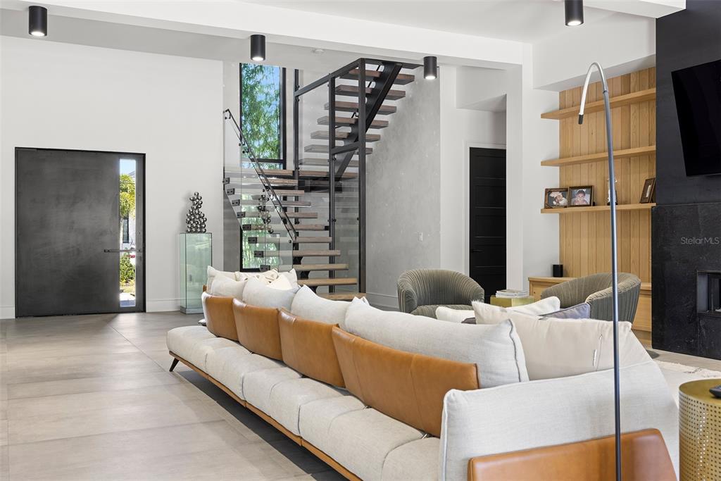 4924 West San Rafael Street Tampa, FL 33629 - Photo 42 of 64 a living room with furniture window and a flat screen tv