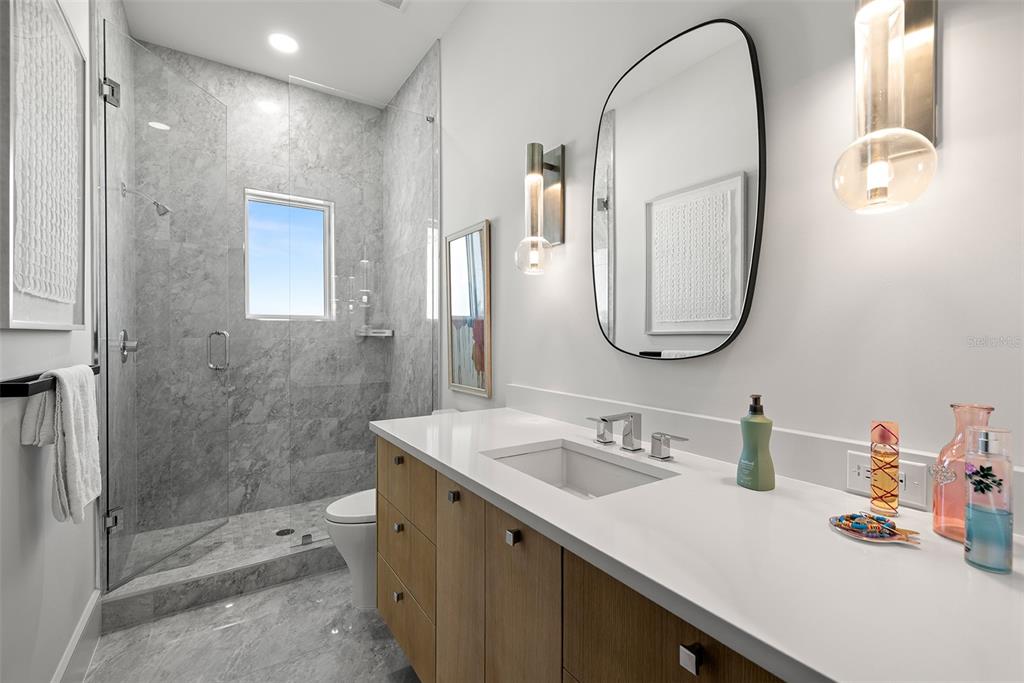 4924 West San Rafael Street Tampa, FL 33629 - Photo 49 of 64 a bathroom with a sink vanity granite and a mirror