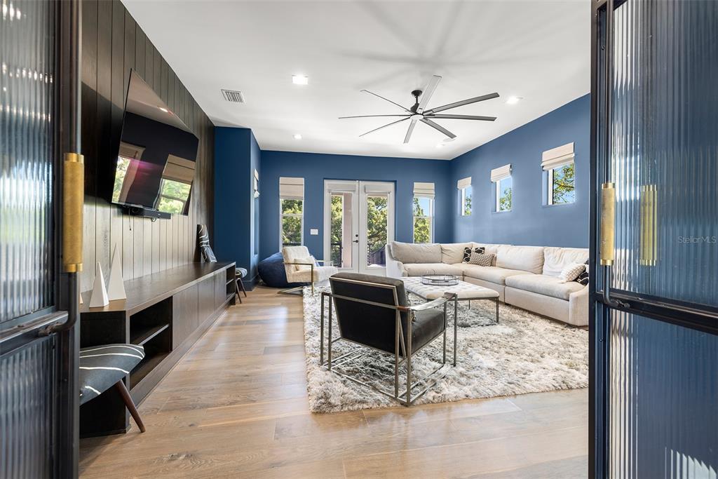 4924 West San Rafael Street Tampa, FL 33629 - Photo 52 of 64 a living room with furniture and a flat screen tv