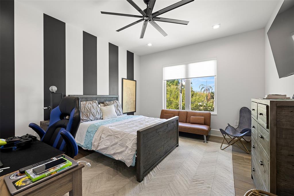 4924 West San Rafael Street Tampa, FL 33629 - Photo 54 of 64 a bedroom with a bed gym equipment and a window