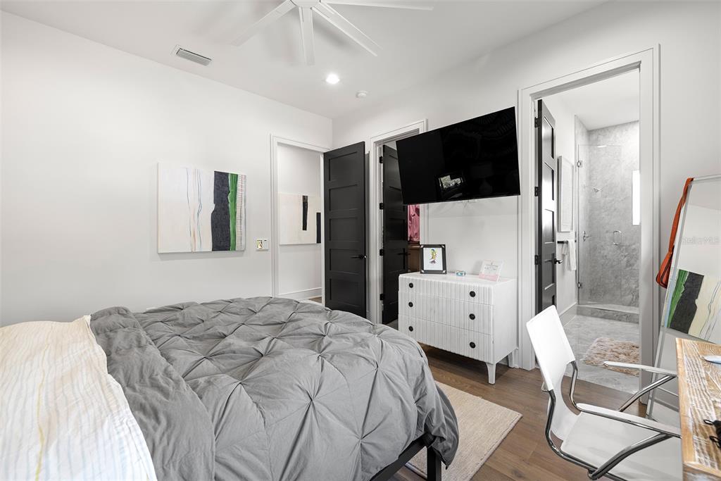 4924 West San Rafael Street Tampa, FL 33629 - Photo 58 of 64 a bedroom with a bed and a flat screen tv