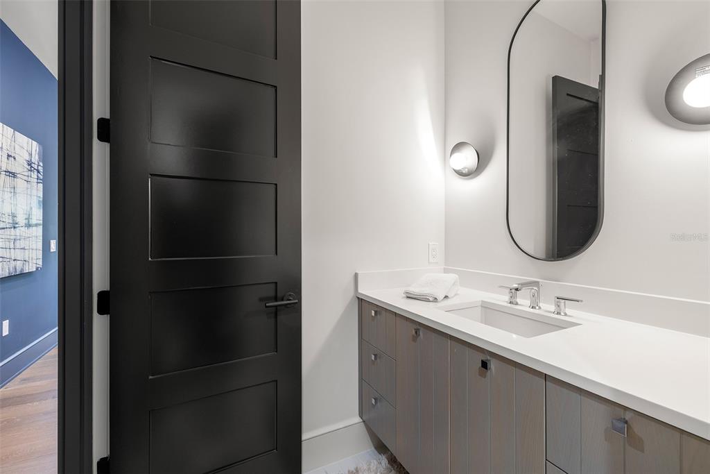 4924 West San Rafael Street Tampa, FL 33629 - Photo 59 of 64 a bathroom with a sink vanity and a mirror