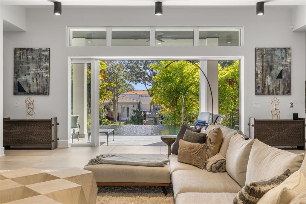 4924 West San Rafael Street Tampa, FL 33629 - Photo 6 of 64 a living room with furniture and a fireplace