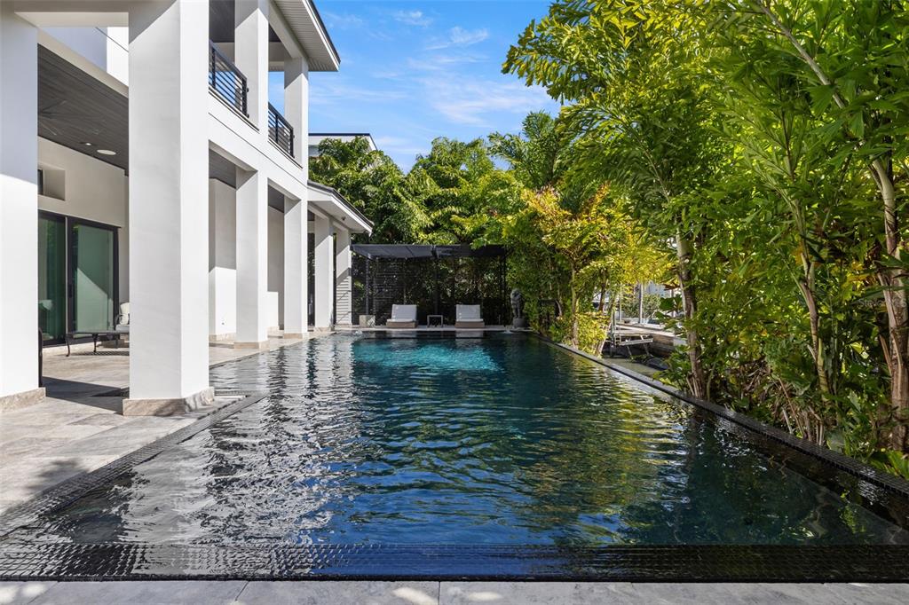 4924 West San Rafael Street Tampa, FL 33629 - Photo 8 of 64 a view of a water pond with seating area