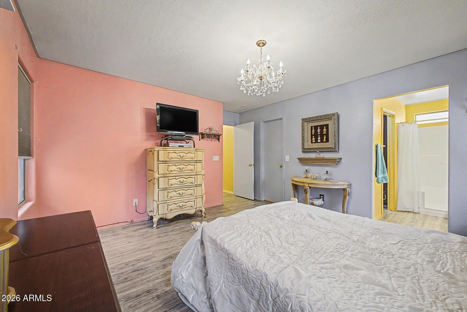 3691 South Conestoga Road Apache Junction, AZ 85119 - Photo 15 of 31 a bedroom with a bed and a television