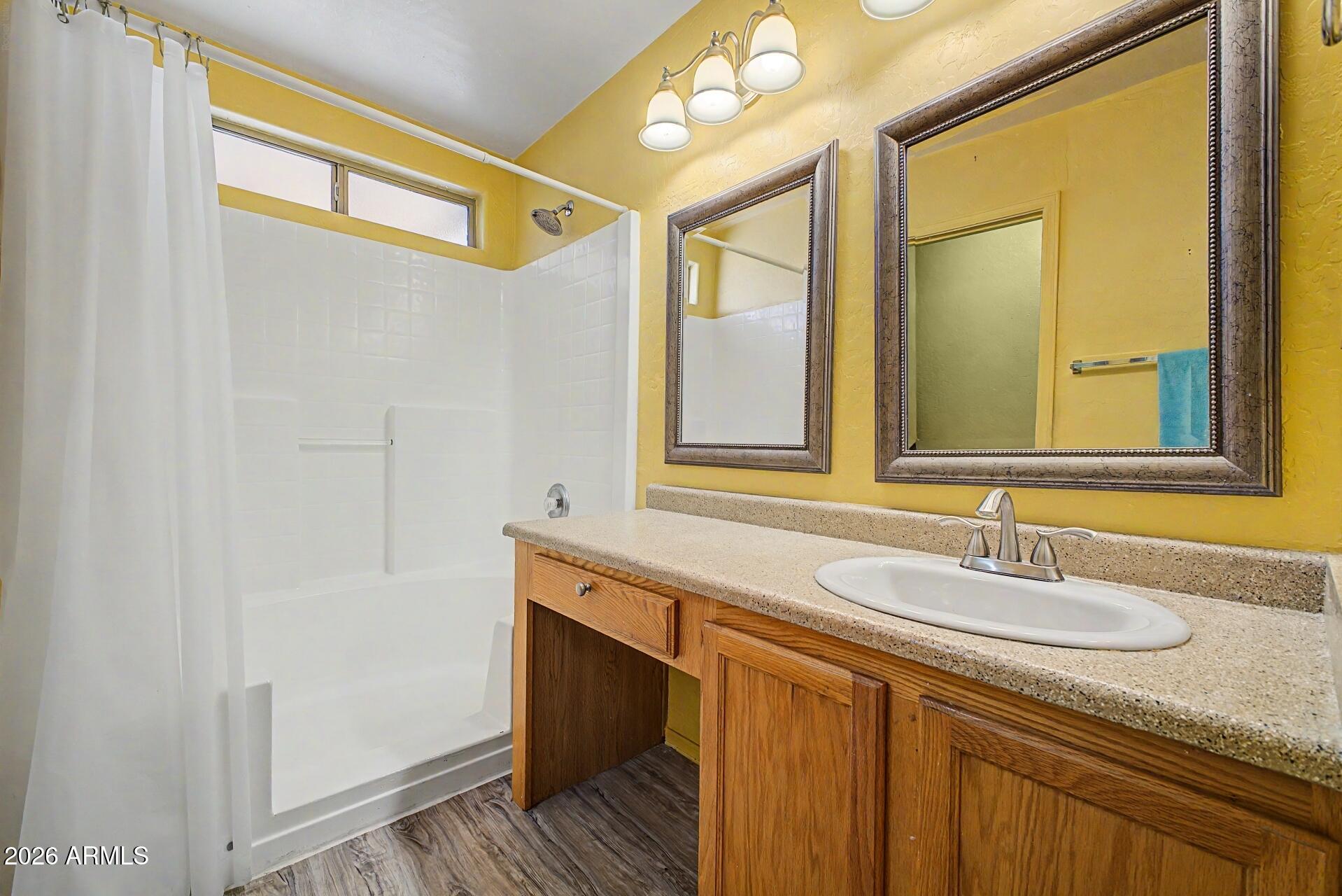 3691 South Conestoga Road Apache Junction, AZ 85119 - Photo 17 of 31 a bathroom with a sink and a mirror