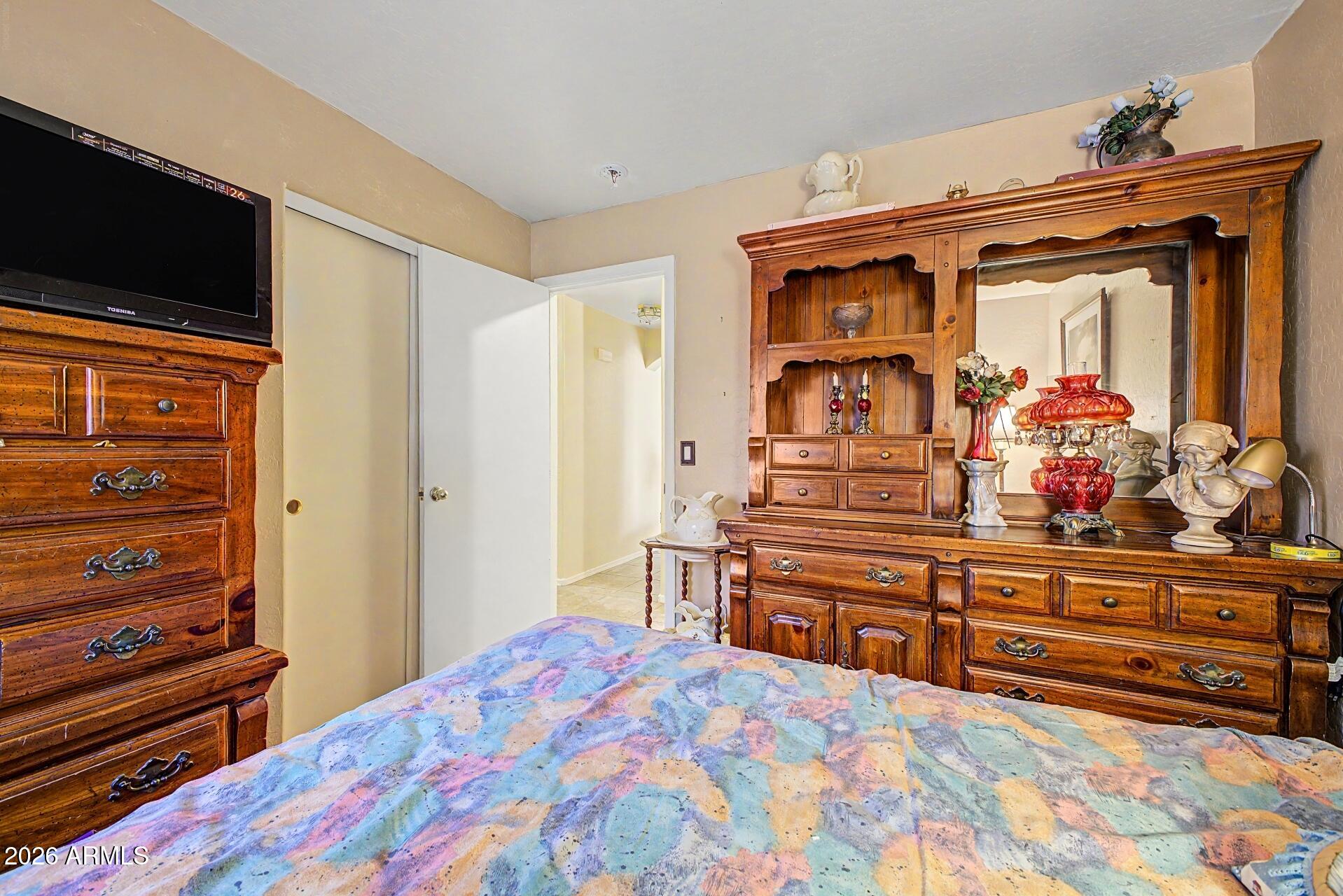3691 South Conestoga Road Apache Junction, AZ 85119 - Photo 22 of 31 a bedroom with a bed and furniture